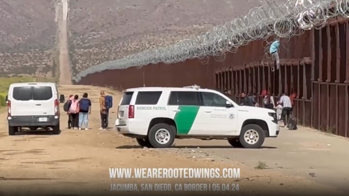 Mob of Illegals Climb Over California Barrier, ‘High-Five’ Border Patrol Agent