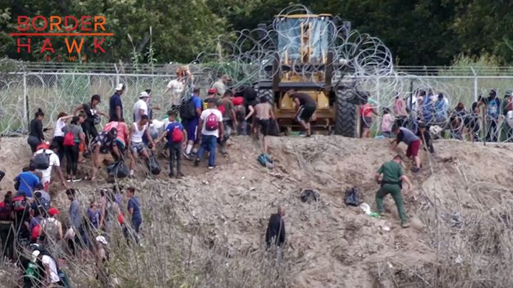 EXCLUSIVE: Biden Regime Deploys Heavy Machinery to LIFT Razor Wire for Massive Mob of Illegals at Rio Grande
