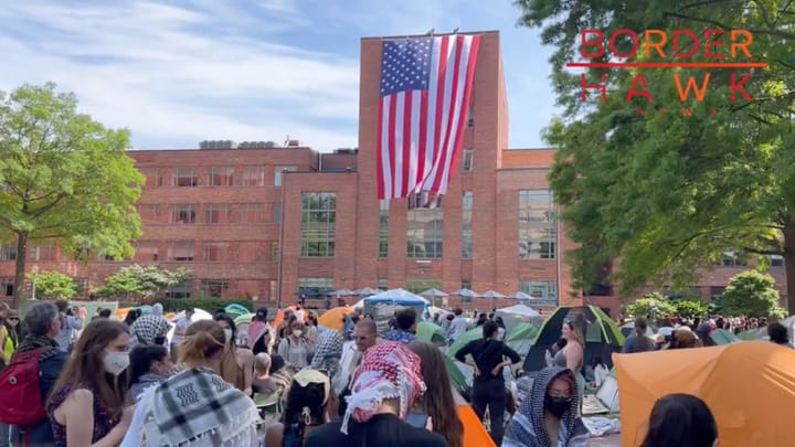 WATCH: Men Unfurl Massive American Flag at George Washington University as Campus Communists Protest